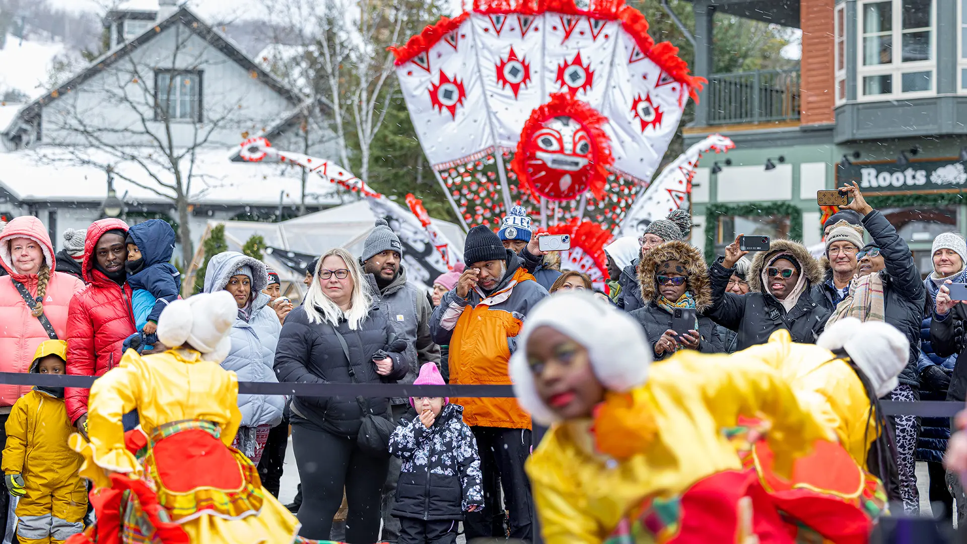 _52A8283 Carnival masqueraders parading through Blue Mountain Village